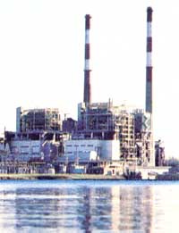 Large factory smokestacks contribute to the increasing acidity of rain.